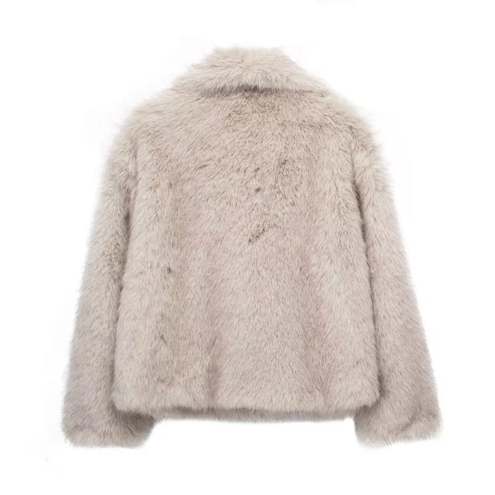 Beige fluffy jacket on a white background