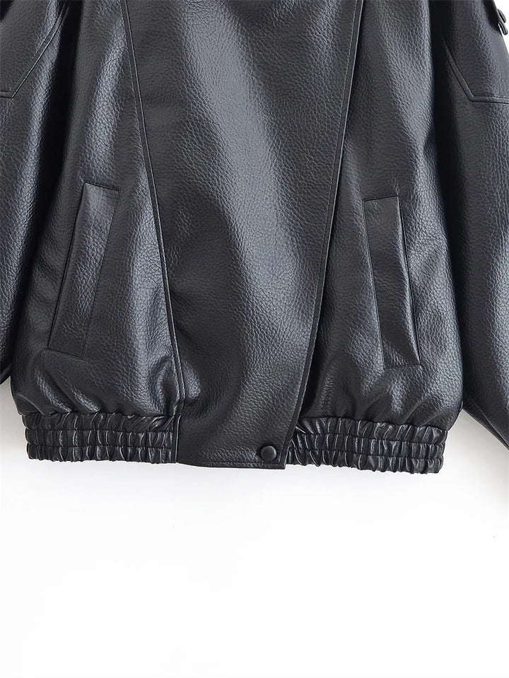 Close-up of a black leather jacket on a white background